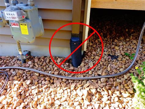 can a rain gutter downspout go over the electrical box|underground cable around gutter.